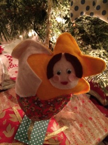 This hand-stitched little guardian keeps watch at the foot of our tree.